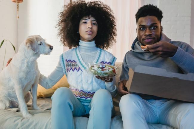 Dog and couple watching TV